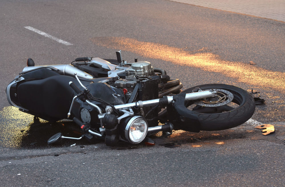 Downed motorcycle in the middle of the road